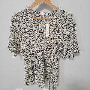 NEW short sleeve blouse. Cheetah size medium.